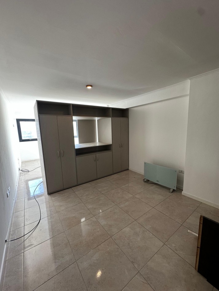 Monoambiente en edificio moderno con cochera